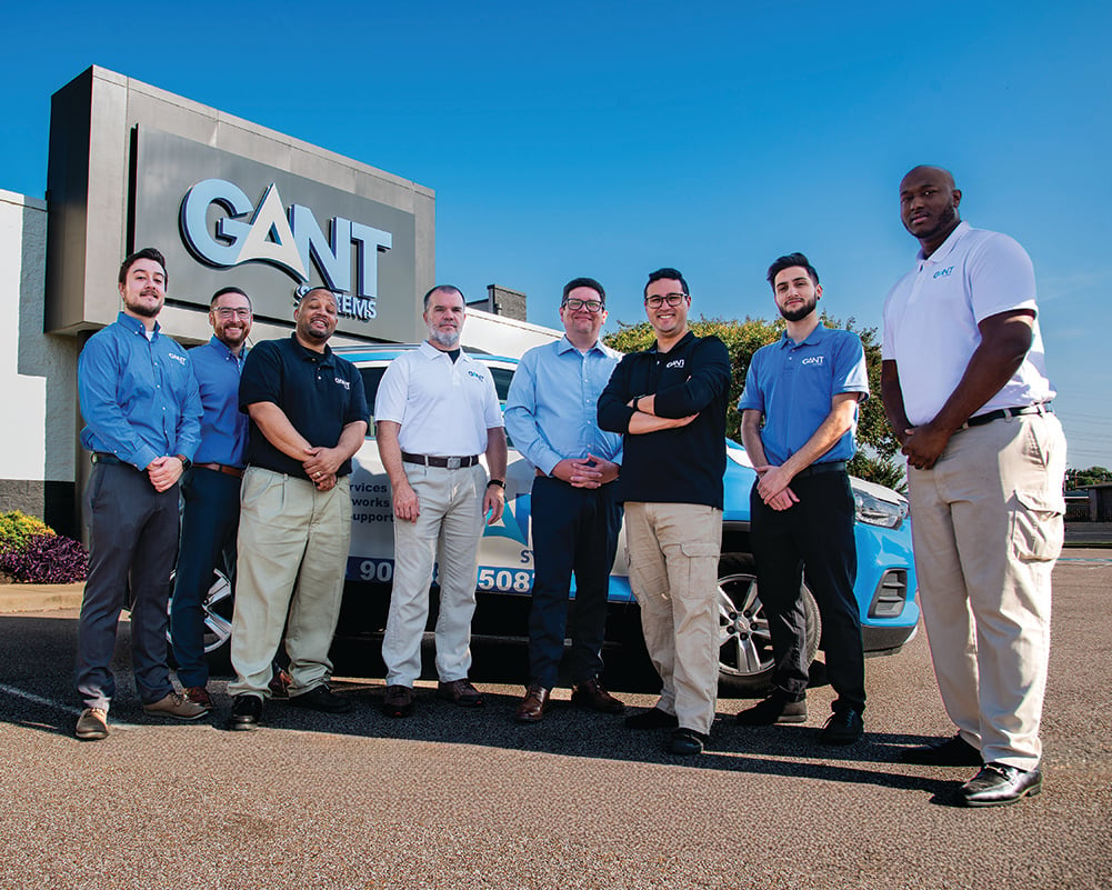 the Gant team standing outside main Memphis hq in front of Gant branded vehicle